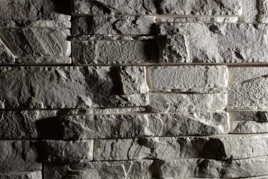 Backlit stone background with beautiful long shadows.