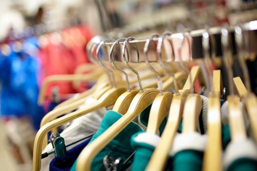 Hangers in the clothes store. Shallow depth of field.