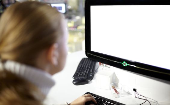 The young girl and a blank monitor.