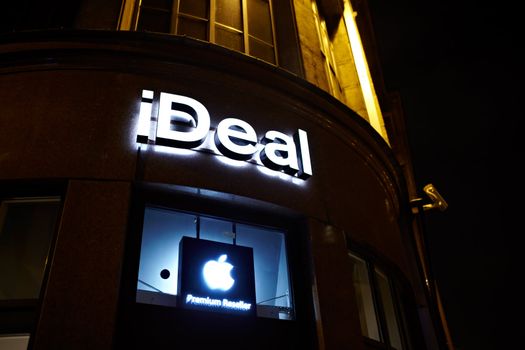 RIGA, LATVIA - OCTOBER 11: Premium Apple Resseler's store "iDeal" sign illuminated at night on October 11, 2012 in Riga, Latvia.