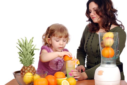 Little and adult girl made fruit juice studio shot