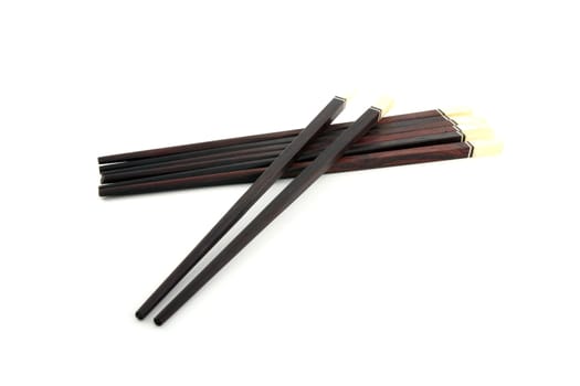 Thai wooden chopsticks on white background