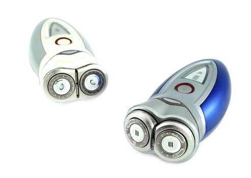 two electric shaver isolated with white background