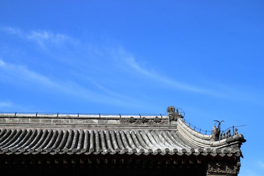 detail of ancient chinese roof with sky