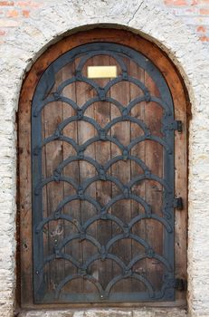 Old wooden door from medieval era. Dubno, Ukraine