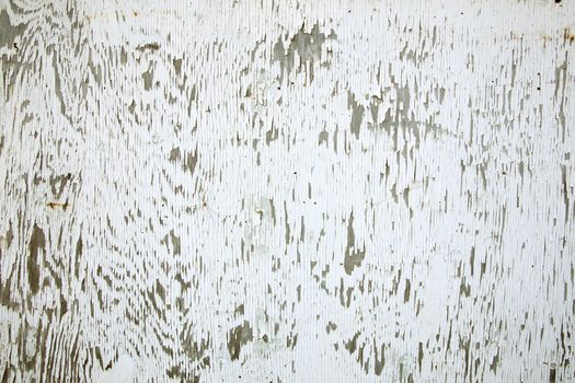abstract pattern of old weathered board with white paint
