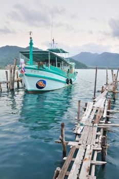 Local tour boat docked at Koh Chang island port, Thailand