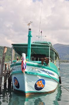 Local tour boat docked at Koh Chang island port, Thailand