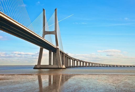 Vasco da Gama bridge in Lisbon, Portugal. On Blue Sky