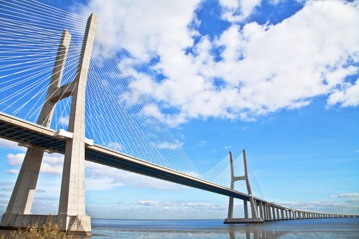 Vasco da Gama bridge in Lisbon, Portugal. On Blue Sky