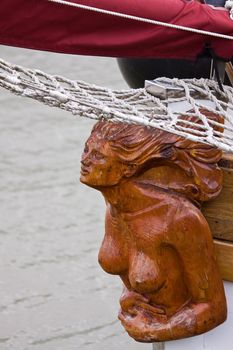 Traditional figurehead on the bow of a sail boat