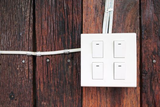 buzzer switch on wooden wall