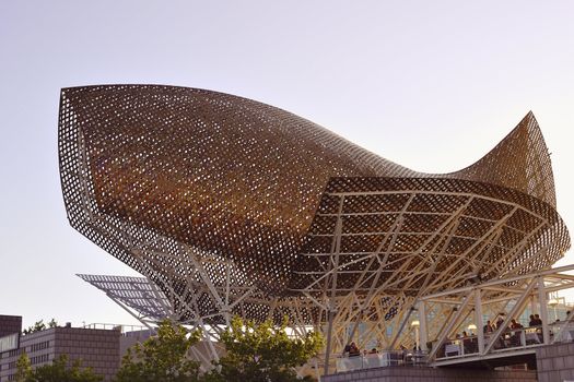 Barcelona, Spain - June 21, 2010 :  Famous Peix sculpture (Gold Fish) at the place of Port Olimpic in Barcelona. This sculpture is Frank O. Gehry artwork built for 1992 Summer Olympics.