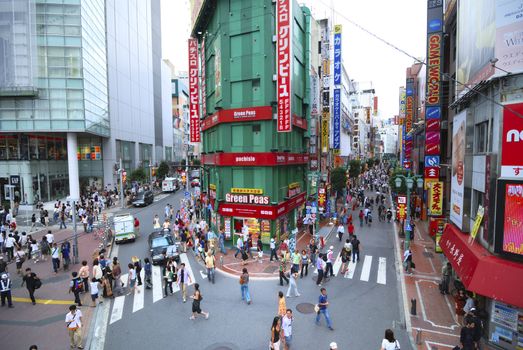 Tokyo, Japan - September 01,  2007: Pedestrians walking on scenic streets close to JR station in famous Shinjuku area in Tokyo, Japan