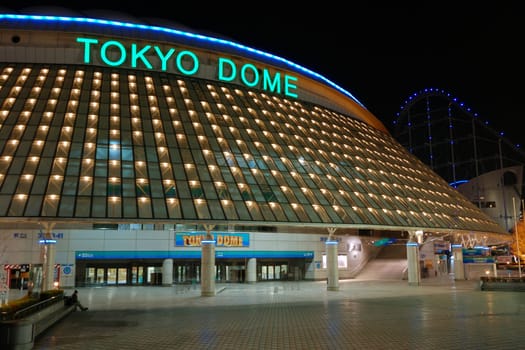 Tokyo, Japan - February 14, 2008: famous Tokyo Dome arena building in Korakuen district of Japanese capital with scenic evening illumination. Also Tokyo Dome is known as largest concert hall in Japan.