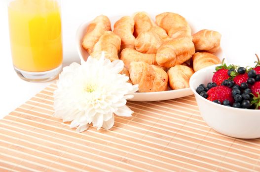 Breakfast with berries,orange juice and croissant, early breakfast