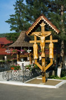 monastery, a well and a crucifix