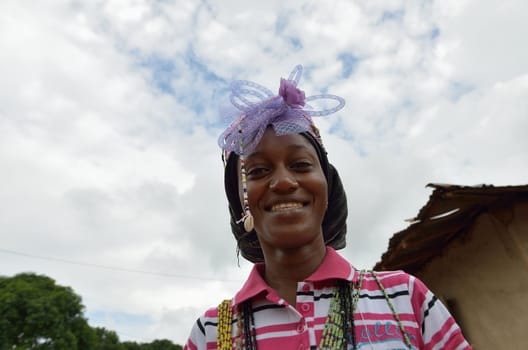 Kartiak,Senegal-September 18,2012 :African woman with the typical hat to go to the ritual of Boukoutt of Initiation ceremony on September 18, 2012 in Kartiak, Senegal. The ceremony occurs every 30 years and celebrates boys becoming men.