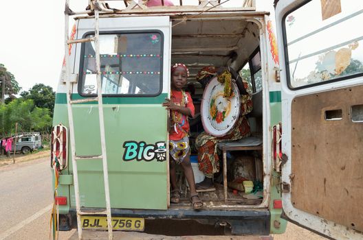 Kartiak,Senegal-September 18,2012 :An unidentified African child into a van to go to the ritual of Boukoutt of Initiation ceremony on September 18, 2012 in Kartiak, Senegal. The ceremony occurs every 30 years and celebrates boys becoming men.