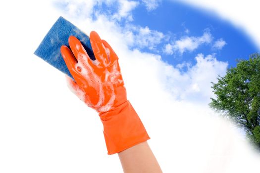 Hand in glove with sponge to clean the sky clears and the green

