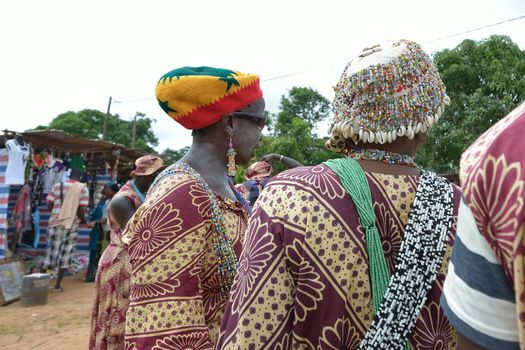 Kartiak,Senegal-September 18,2012 :people on the road go to a ritual of Boukoutt of Initiation ceremony on Sept 18,2012 in Kartiak, Senegal.The ceremony occurs every 30 years and celebrates boys becoming men.