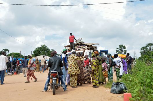 Kartiak,Senegal-September 18,2012 :people on the road go to a ritual of Boukoutt of Initiation ceremony on Sept 18,2012 in Kartiak, Senegal.The ceremony occurs every 30 years and celebrates boys becoming men.