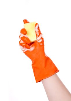 Hand with orange glove holding foamy cleaning sponge isolated on white
