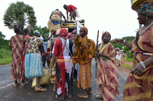 Kartiak,Senegal-September 18,2012 :people on the road go to a ritual of Boukoutt of Initiation ceremony on Sept 18,2012 in Kartiak, Senegal.The ceremony occurs every 30 years and celebrates boys becoming men.