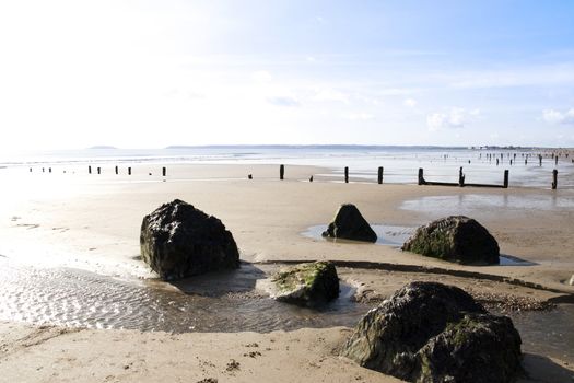 sunshine over the beach breakers in Youghal county Cork Ireland on a summers evening