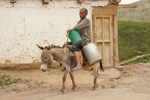 Donkey riding man, Hissar Mountains, Uzbekistan