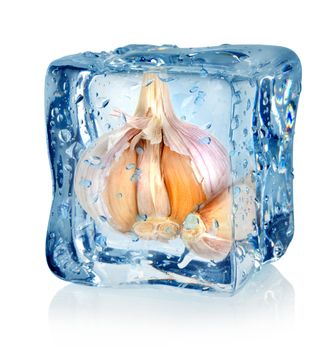 Ice cube and garlic isolated on a white background