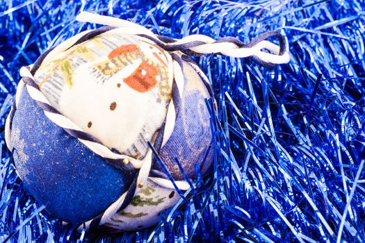 Italy. Traditional handmade Christmas ball made of white and blue fabric