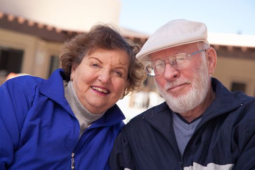 Happy Senior Adult Couple Portrait Bundled Up Outdoors.