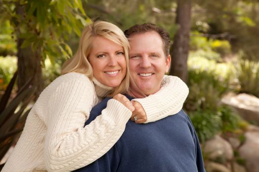 Happy Attractive Adult Caucasian Couple Portrait in the Park.