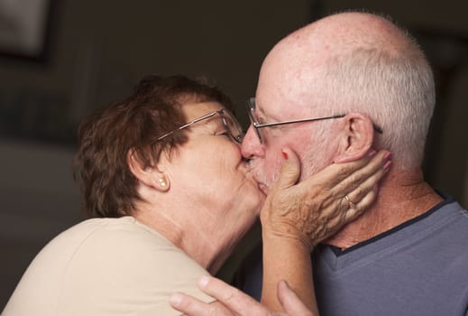 Affectionate Happy Senior Couple Kissing.