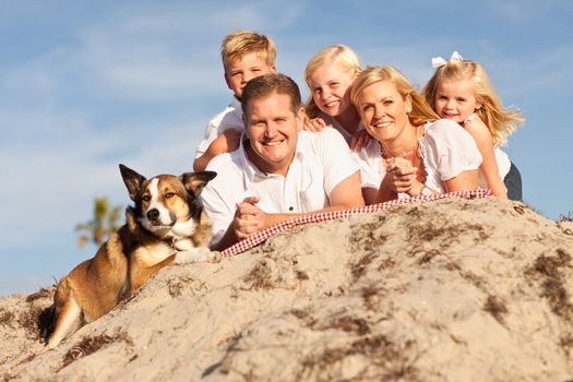 Happy Caucasian Family Portrait at the Beach One Sunny Afternoon.