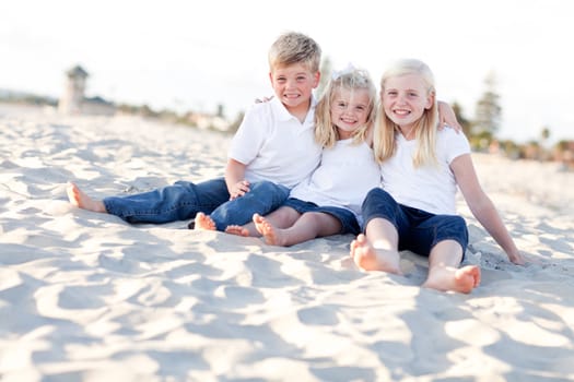 Adorable Sisters and Brother Having A Lot Fun at the Beach.