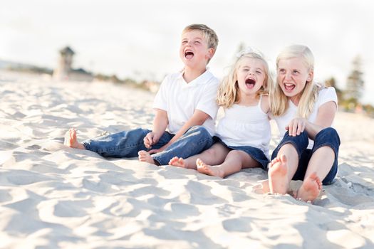 Adorable Sibling Children Portrait at the Beach.