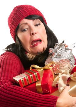 Attractive Woman Fumbling with Her Holiday Gifts Isolated on a White Background.