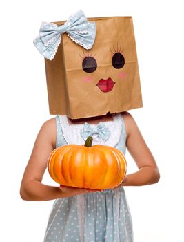 Girl Wearing a Blue Dress and Happy Bag Face Over Her Head Isolated on a White Background.