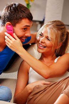 bright picture of happy couple with cellphone