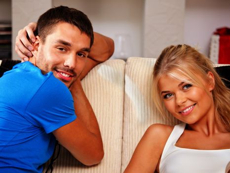 bright picture of happy couple at home (focus on man)