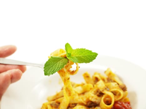 Pasta with meat sauce on towards white background