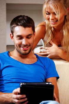 bright picture of happy couple with tablet PC