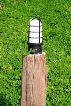 close-up garden lamp on the background of green grass