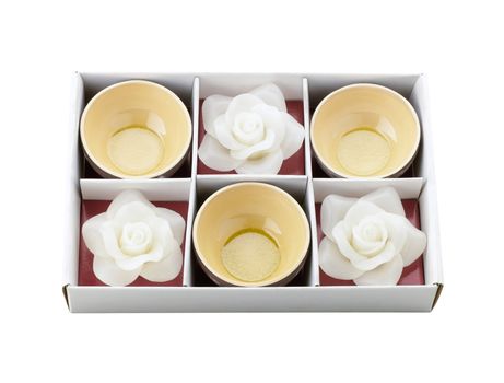 Tea cups and white flower candle storage in the box as a special gift