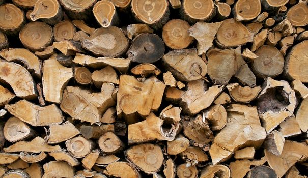 Stacked Firewood Background closeup outdoors