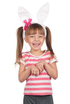 Easter concept image. Portrait of happy little girl with bunny ears over white background.