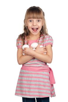 Surprised little girl holding eggs over white background