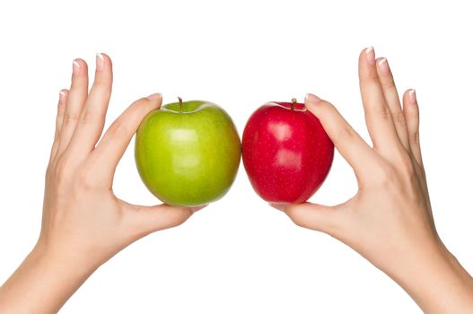 Woman hands with green and red apples isolated on white background